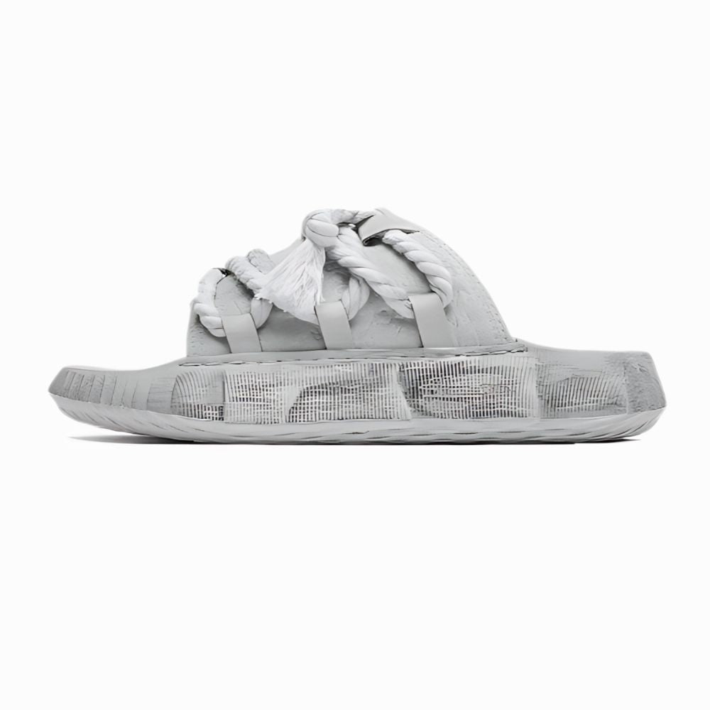 Gray sandal with braided design on a white background