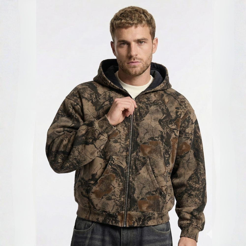 Man wearing a camouflage hoodie on a white background