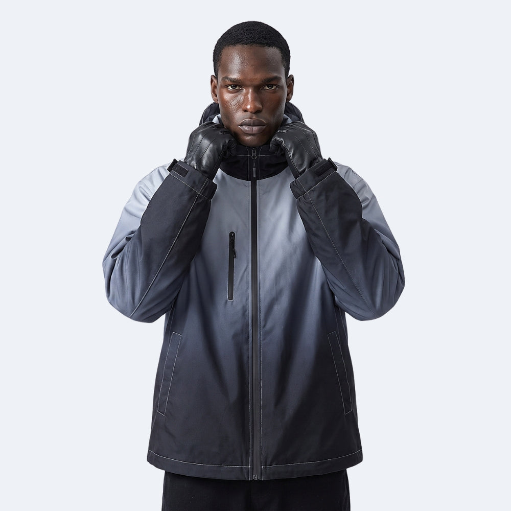 Black. A man wearing a dark gray and black outdoor jacket with matching black gloves.