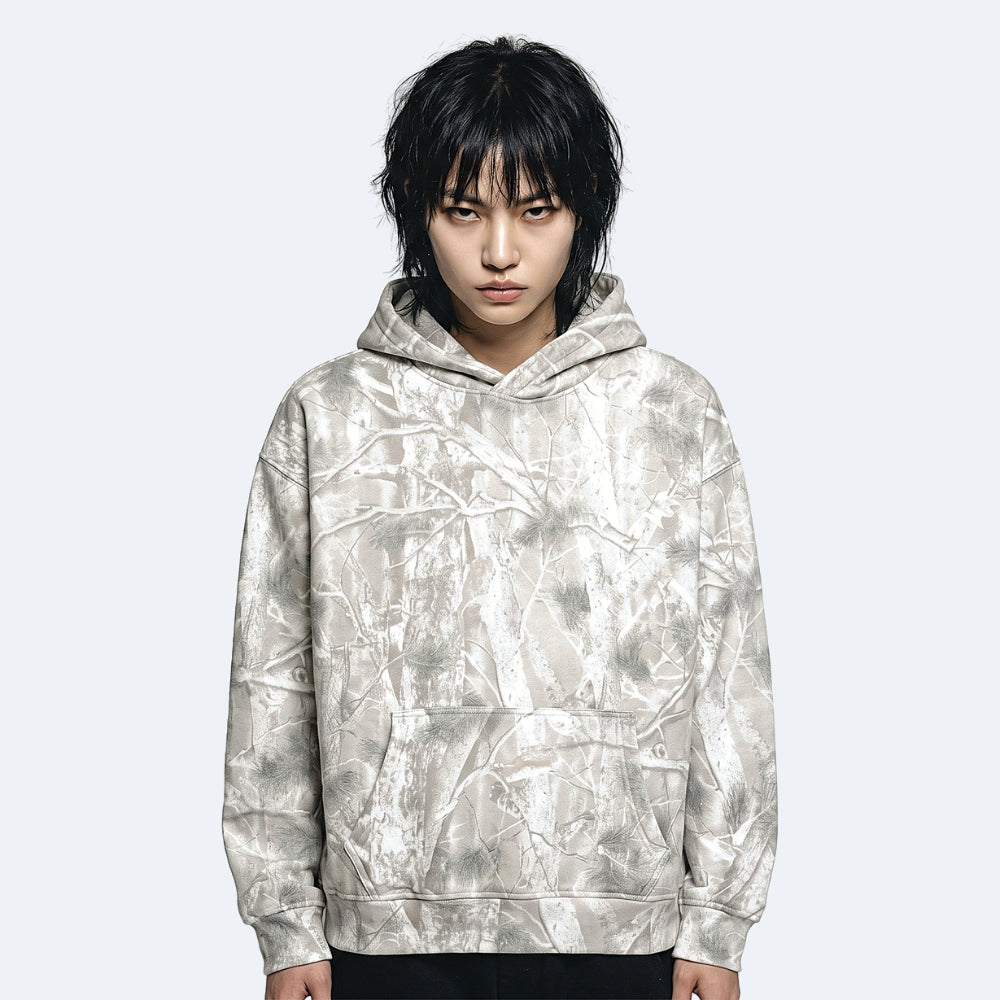 Veins. A model wearing a light gray and white abstract patterned hoodie.