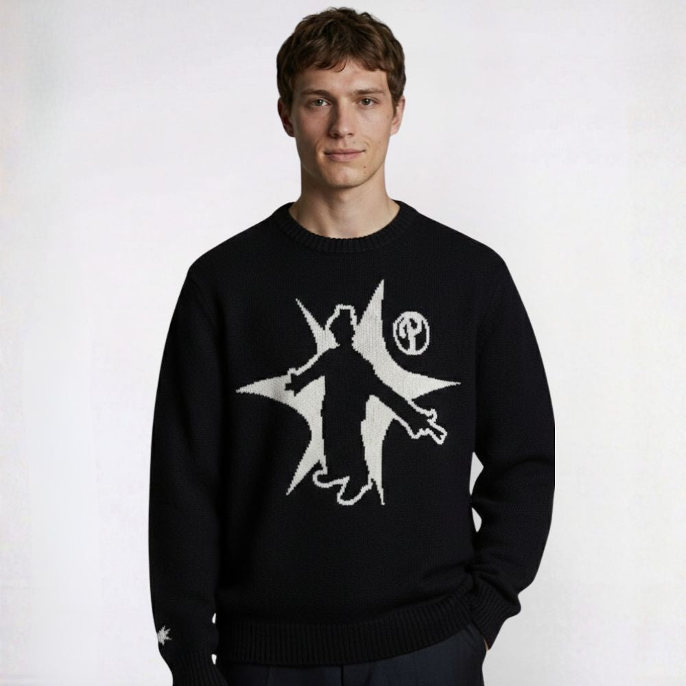 Person wearing a black sweater with a white graphic design on a white background