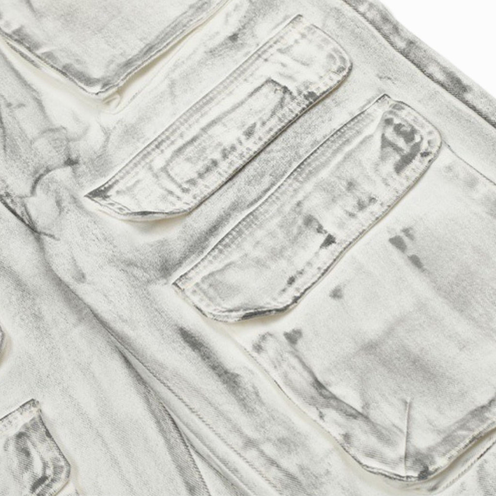 Close-up of light gray denim fabric with stitching details