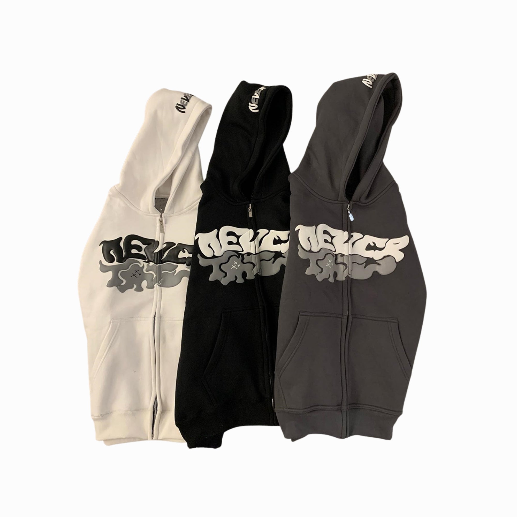 Three hoodies in beige, black, and gray with reflective text design on a white background