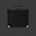 Black suitcase AirPods case with a ribbed texture on a dark gray background