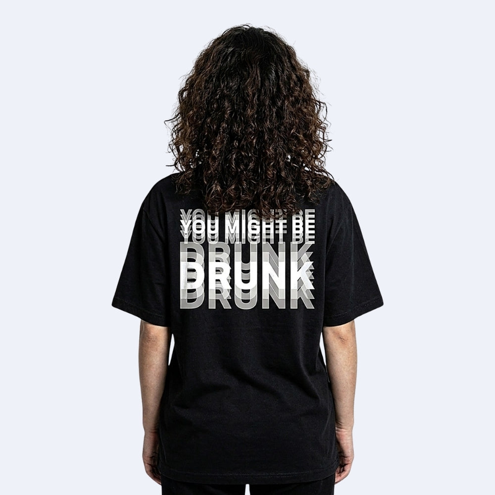 Black. KRUX You Might Be Drunk black tee, layered DRUNK back print shown on a model — streetwear back view