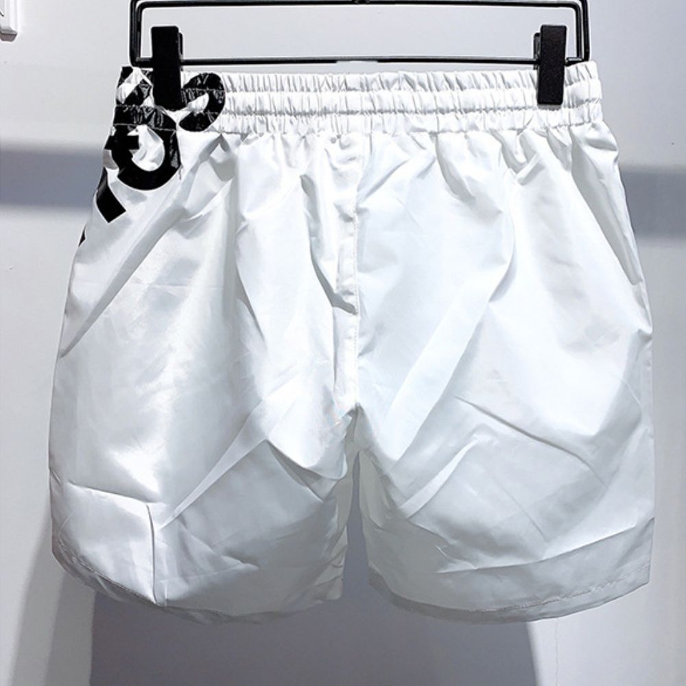 White shorts on a hanger against a white background