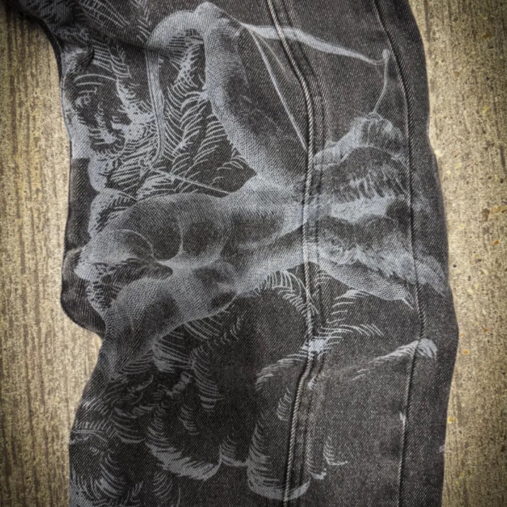 Close-up of a black and white floral pattern on a textured surface