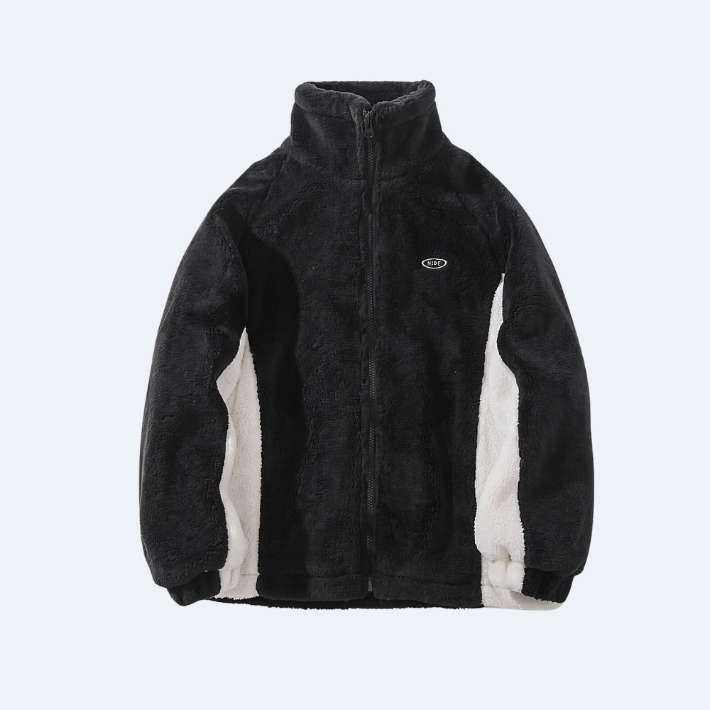 Black. A black fleece zip-up jacket with contrasting off-white side panels and a small oval logo on the left chest.