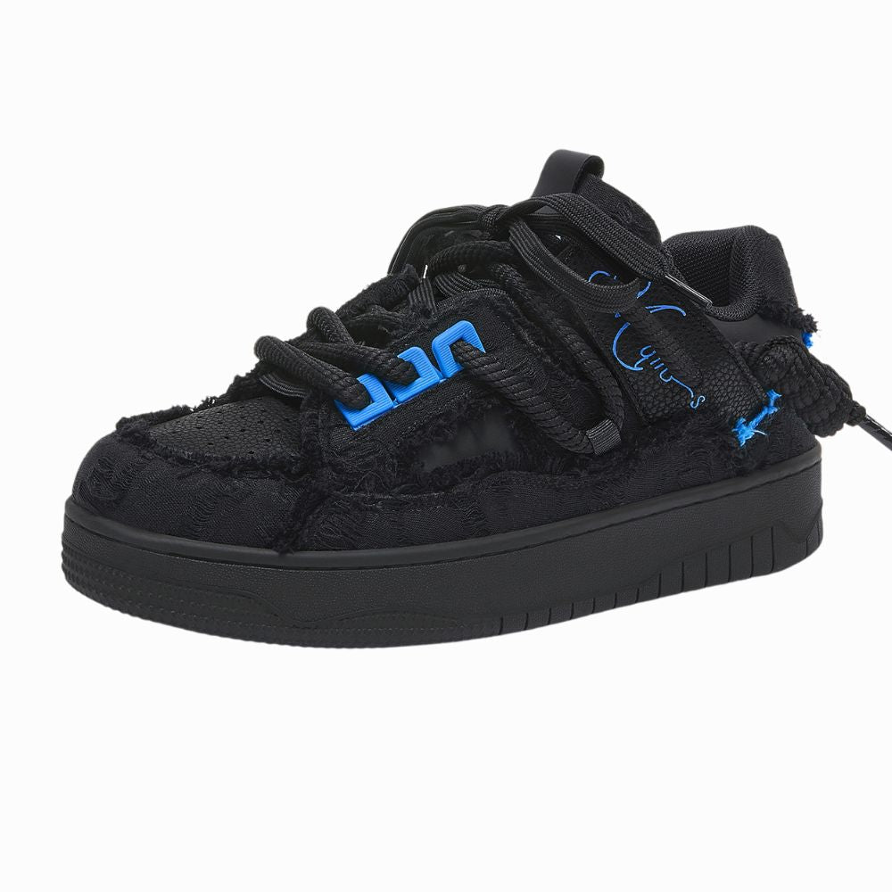 Black sneaker with blue accents on a white background