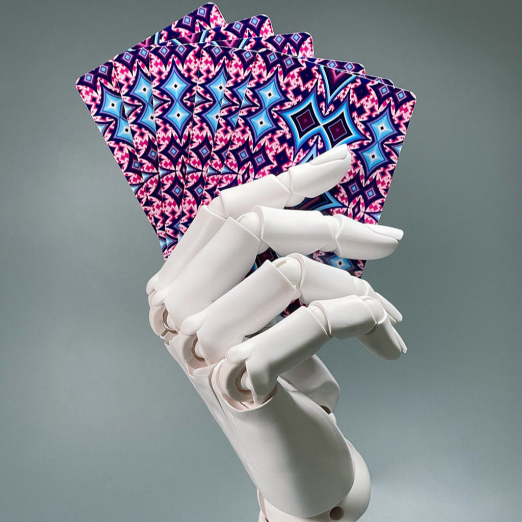 White robotic hand holding pink and blue patterned cards against a gray background