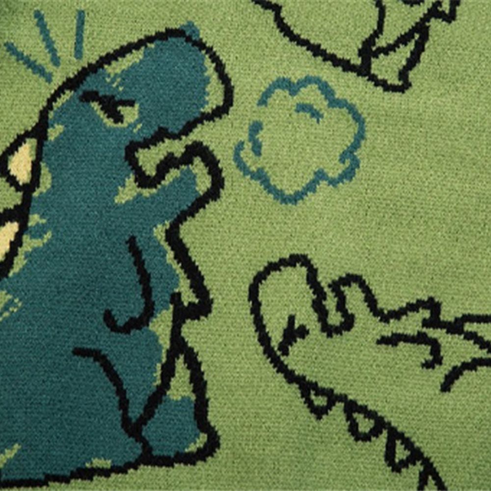 Close-up of a green rug with a cartoon character design.