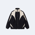 Black. A black and cream color-blocked sherpa fleece zip-up jacket with a stand-up collar.