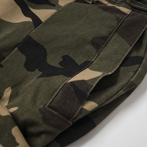 Close-up of a camouflage-patterned fabric on a white background
