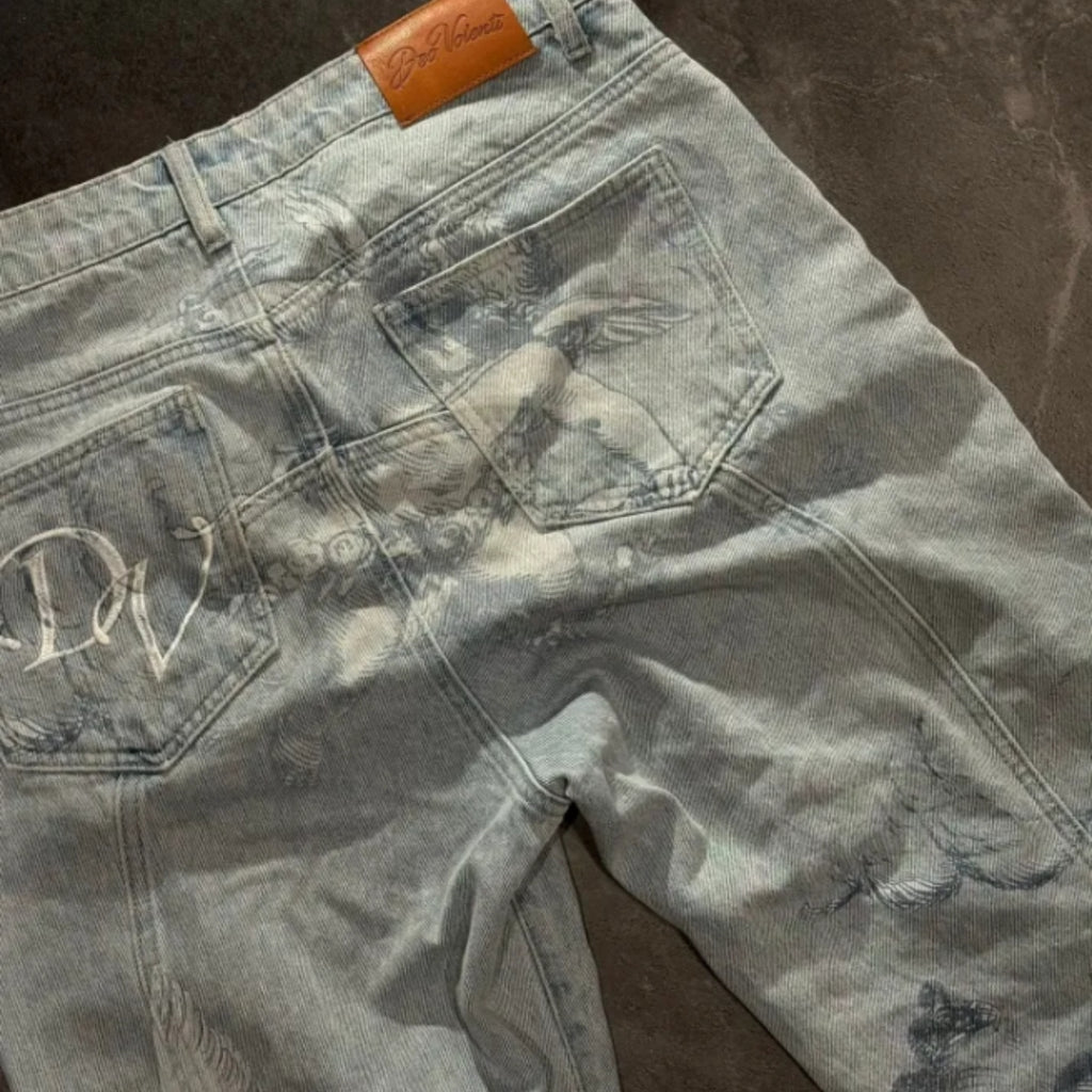 Gray distressed jeans with a brand logo on a brown surface