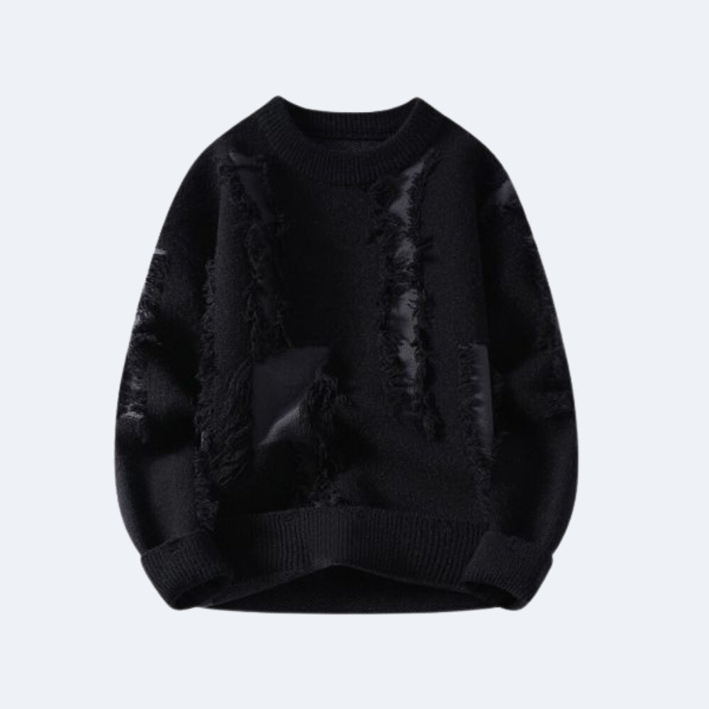 Black. A black long-sleeve knit sweater with distressed, frayed detailing and patchwork-style textured panels.