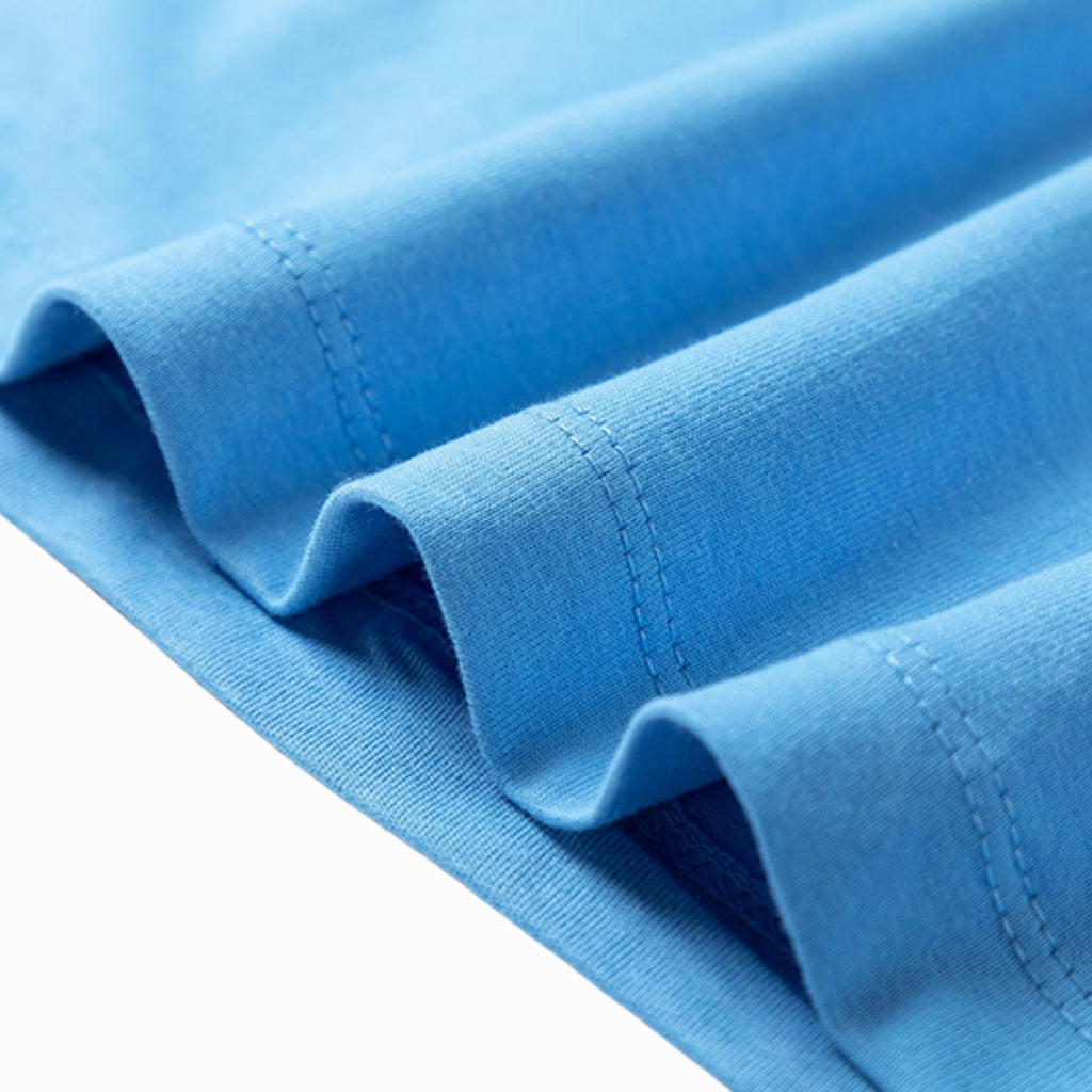 Close-up of blue fabric with a white background