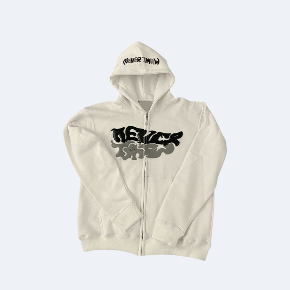 White. An off-white zip-up hoodie with a black and gray graphic on the chest and NEVER TWIN printed in black on the hood.