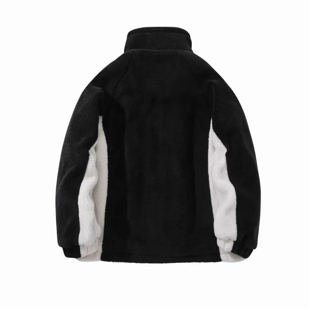 Black fleece jacket with white lining on a white background