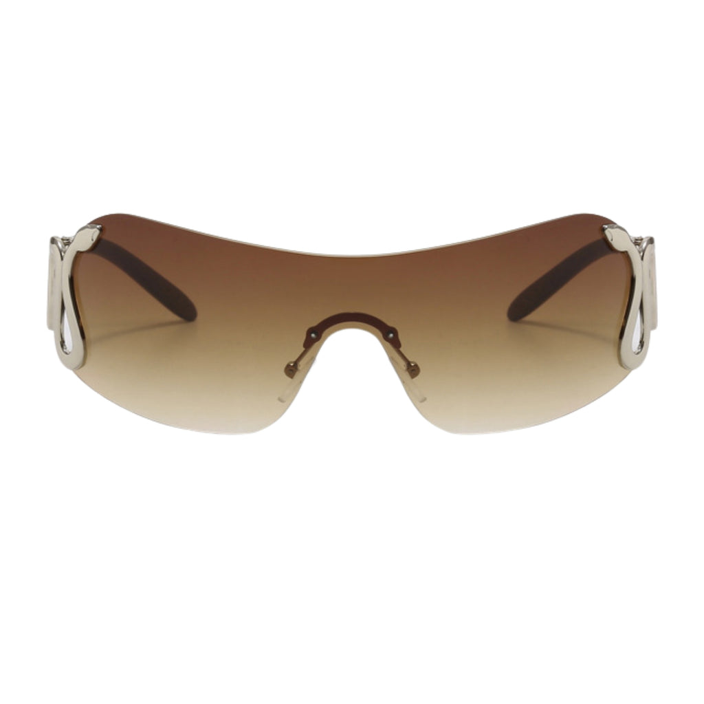 Sunglasses with a brown gradient lens and metallic frame on a white background
