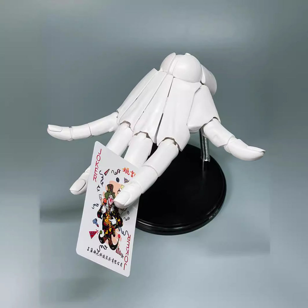 White plastic figure holding a card with colorful design on a gray background
