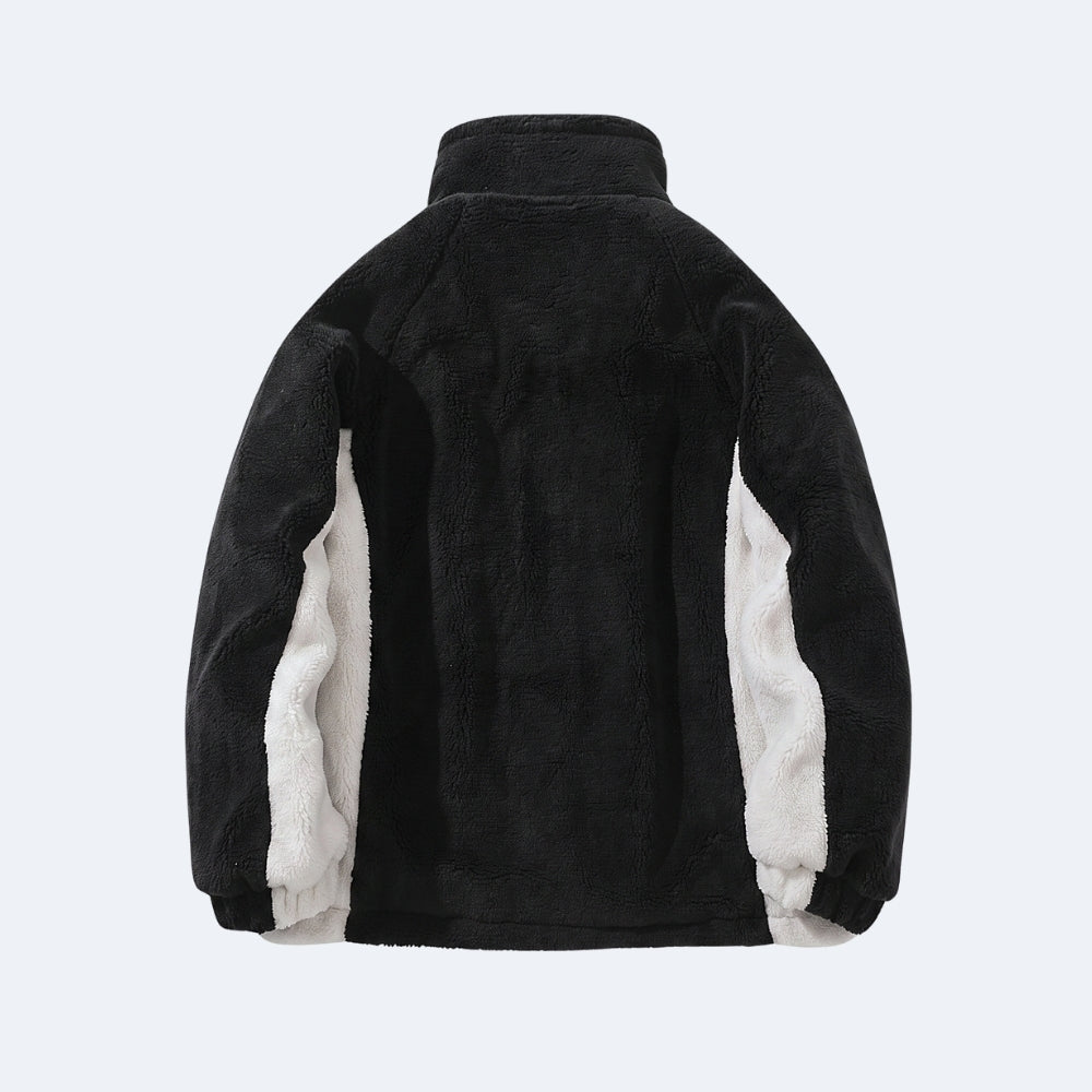 Black. A black fleece jacket with contrasting white sherpa lining on the inner sleeves, shown from the back.