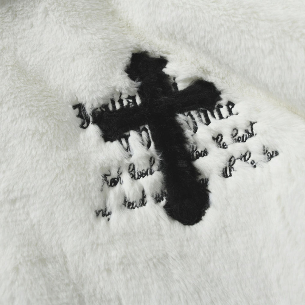 Black cross with text on a white background