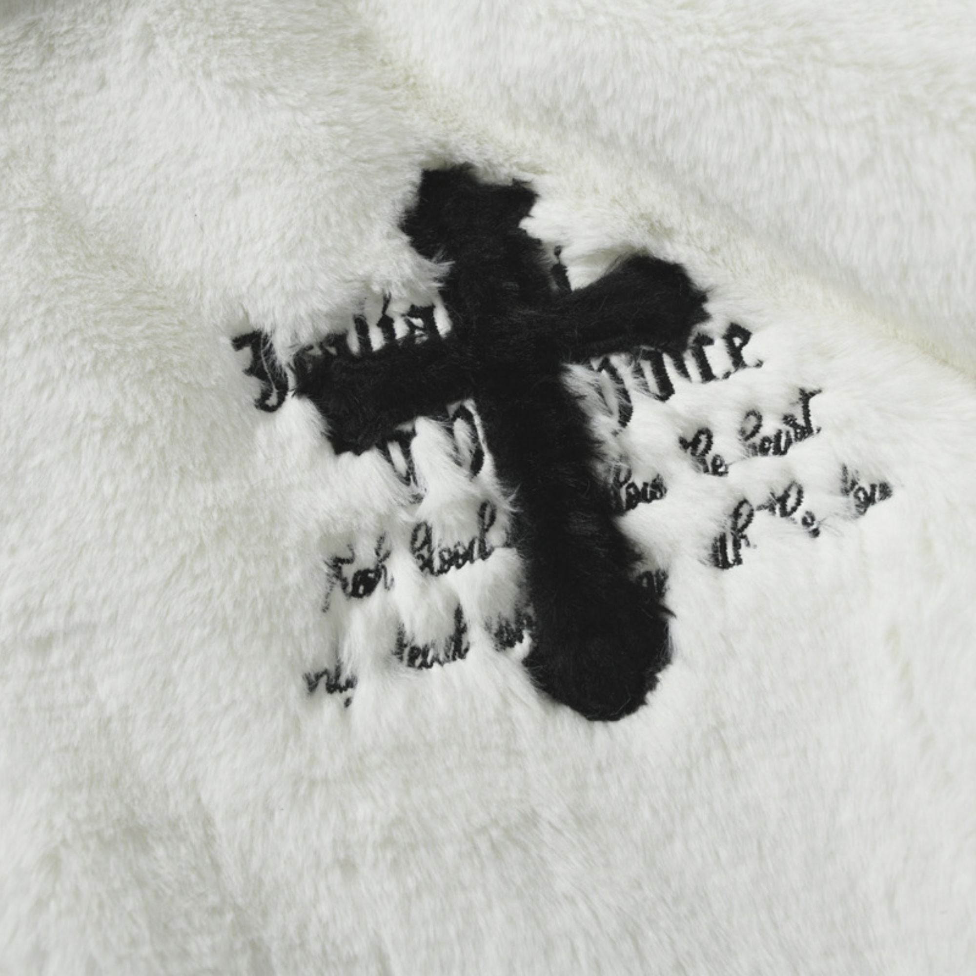 Black cross with text on a white background