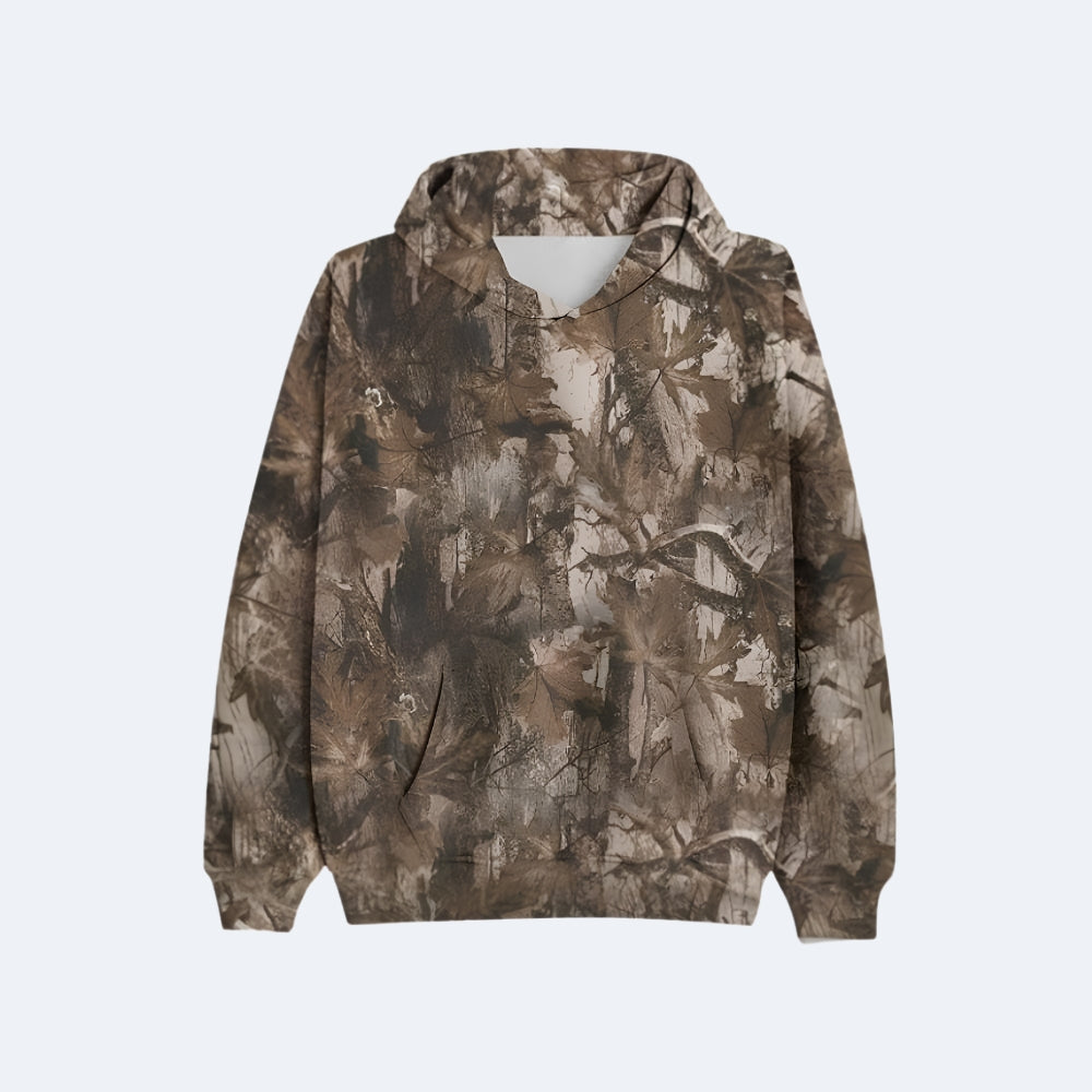Oak. A pullover hoodie featuring an all-over camouflage pattern in shades of brown, beige, and gray.