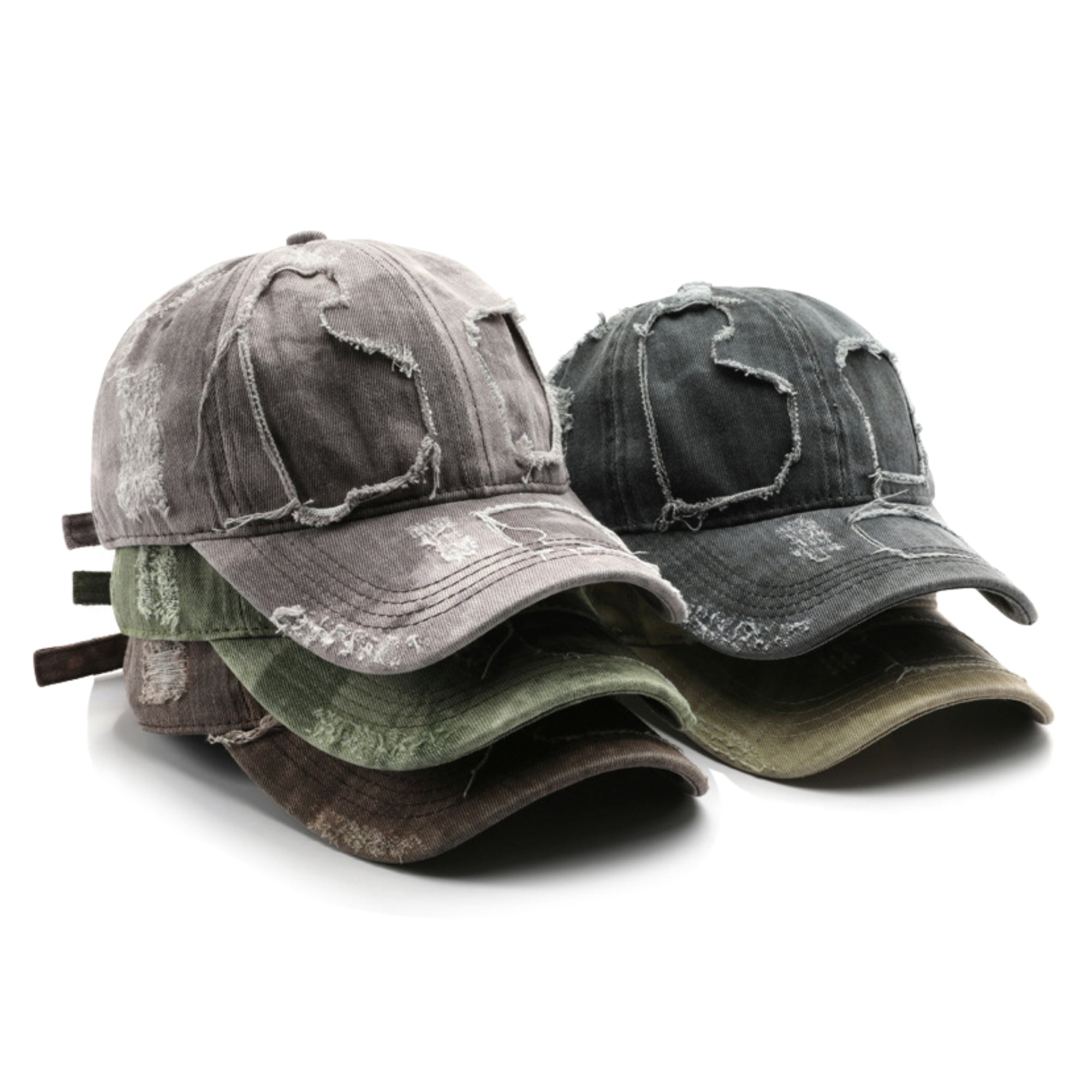Stack of distressed denim caps in various shades on a white background