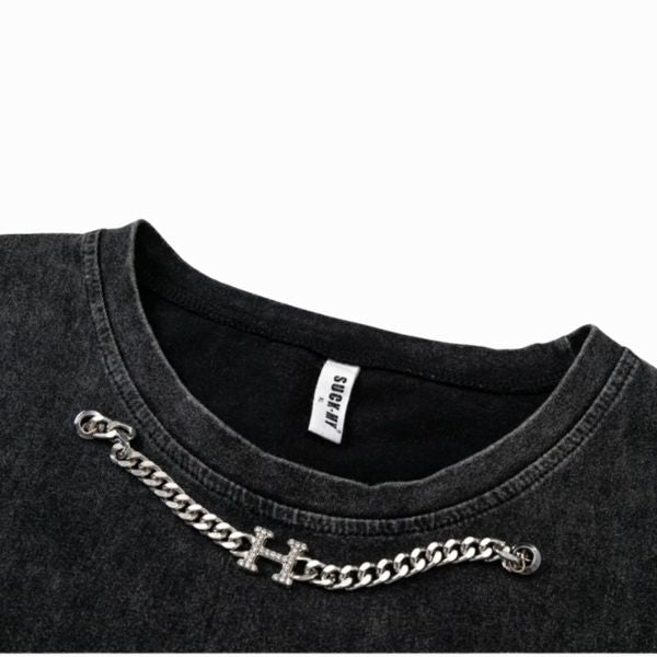 Black t-shirt with a silver chain detail on a white background