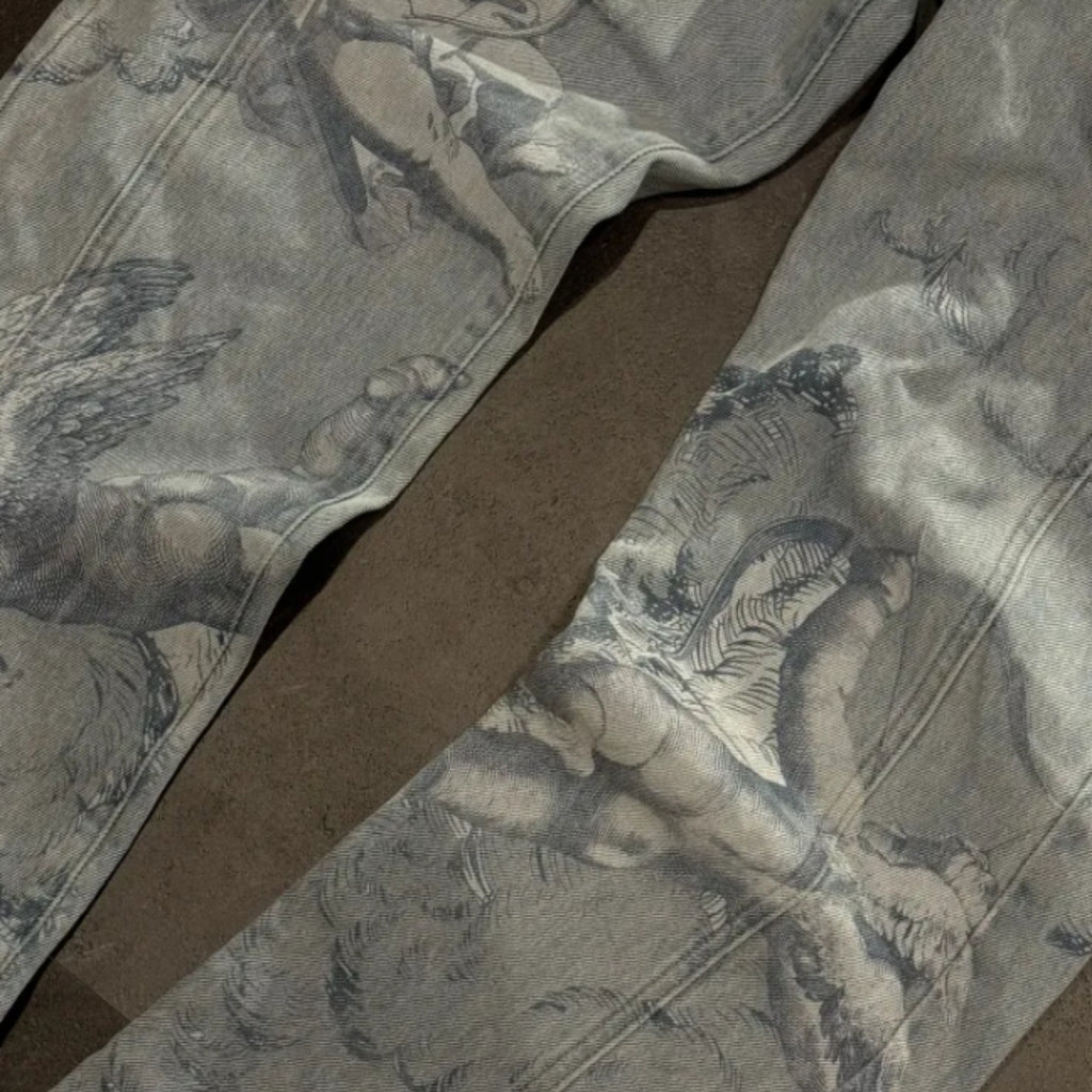Gray fabric with angel and dove pattern on a brown background