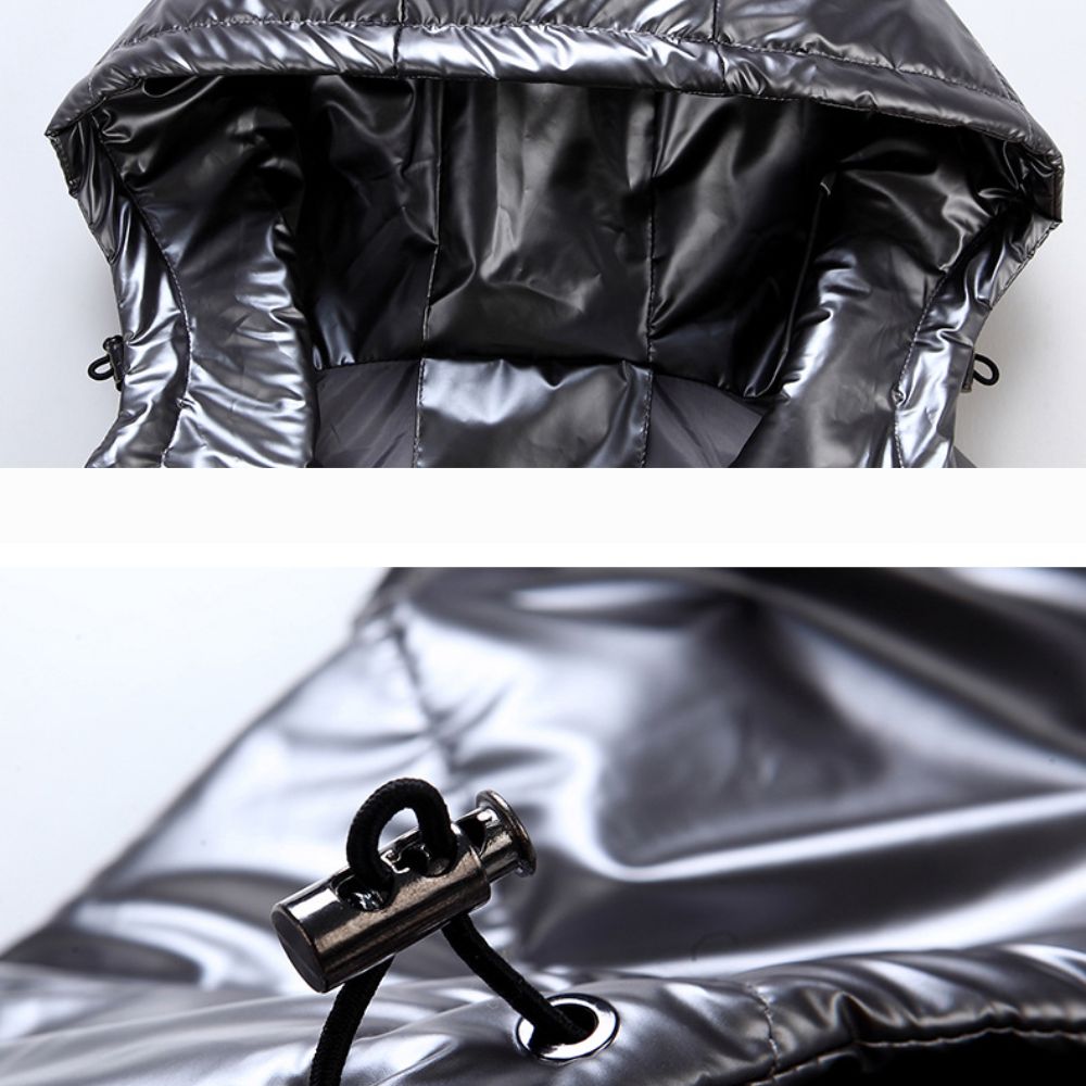 Close-up of a shiny black hooded garment with a reflective zipper pull.