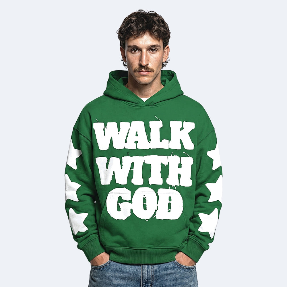 Green. A man wearing a green pullover hoodie with the words WALK WITH GOD printed in large white letters across the front, with white star graphics on both sleeves.