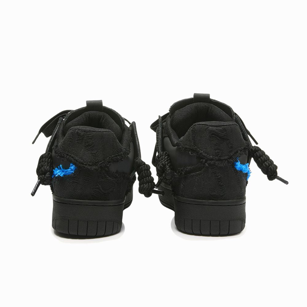 Black high-top sneakers with blue accents on a white background