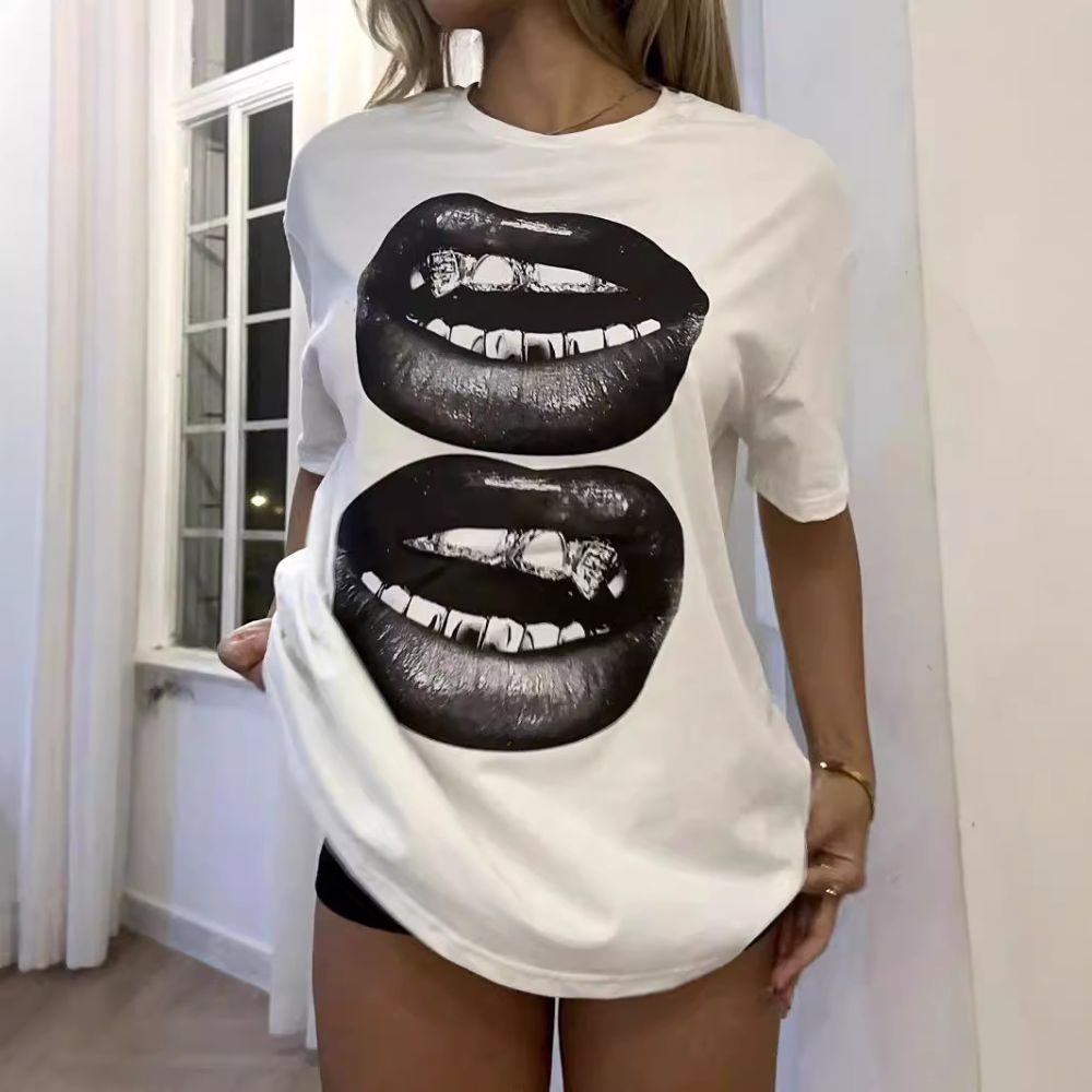 White t-shirt with black lips graphic worn by a person indoors.