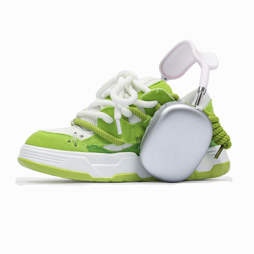 Green and white sneaker on a white background