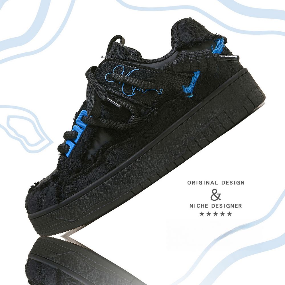 Black sneaker with blue accents on a white background