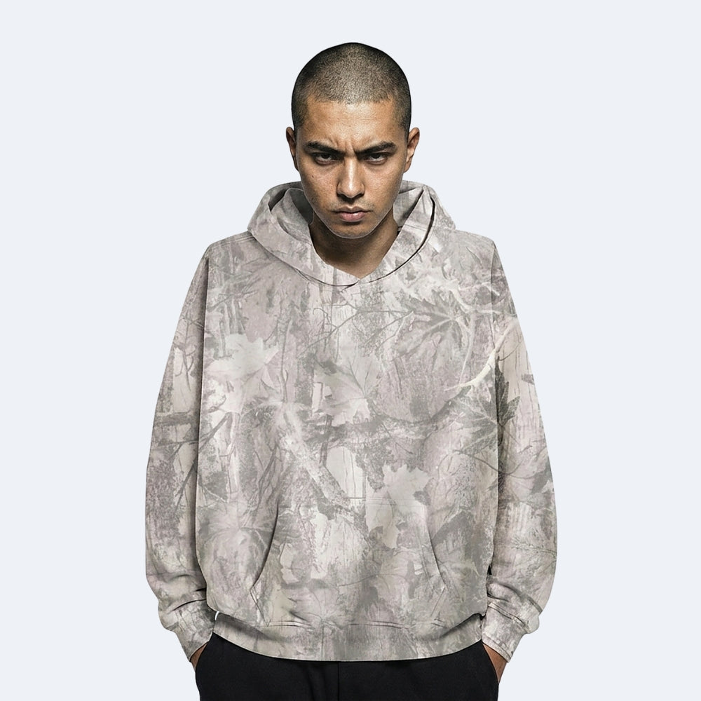 Frost. A man wearing a light gray and white camouflage hoodie.
