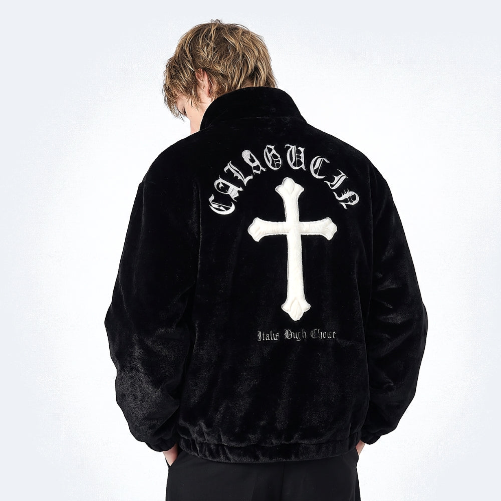 Black. A person shown from the back wearing a black velour jacket with a large white cross and text across the upper back.