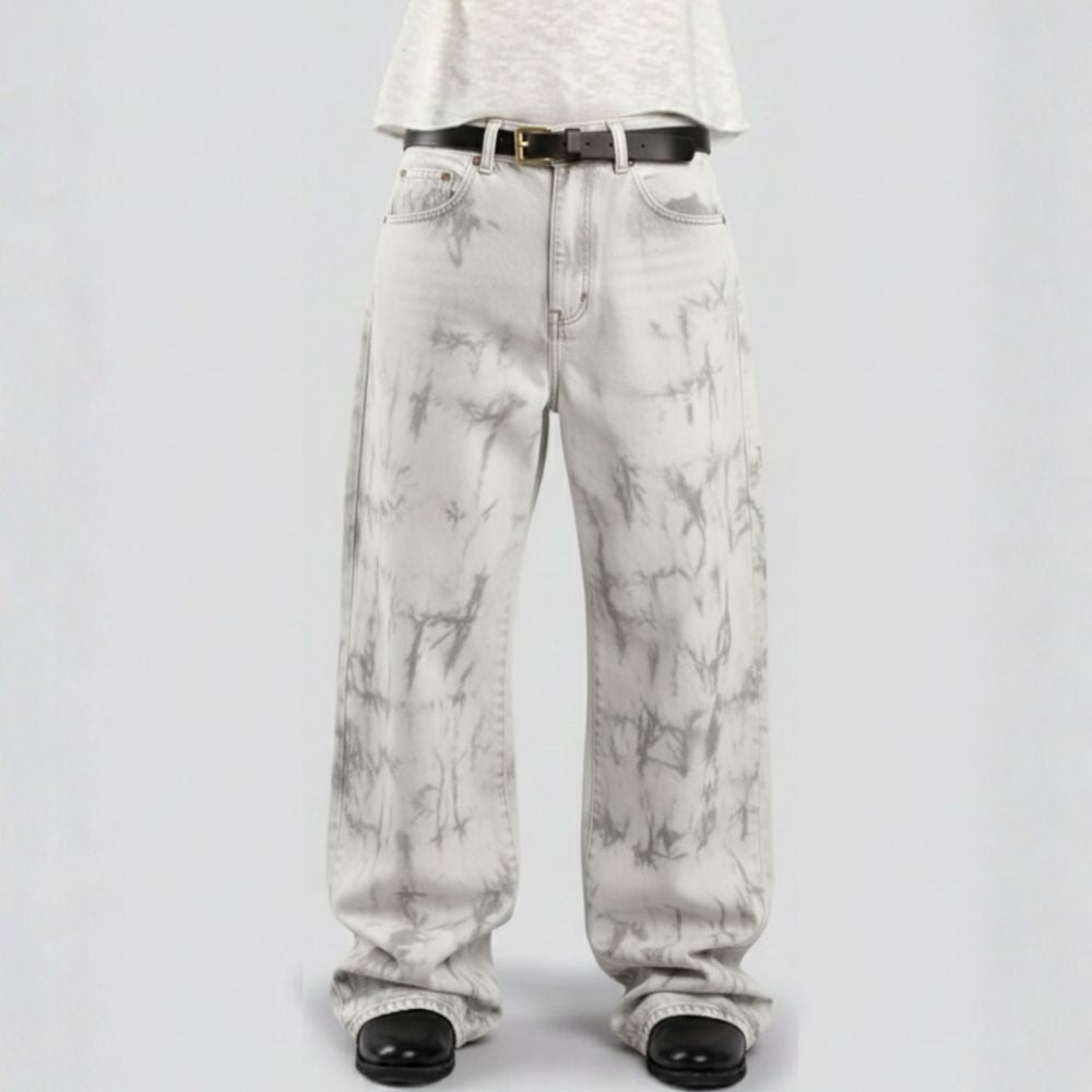 White marble-patterned pants worn by a person on a light gray background