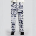 White pants with black abstract patterns on a white background