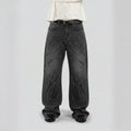 Black jeans with unique designs on a plain background