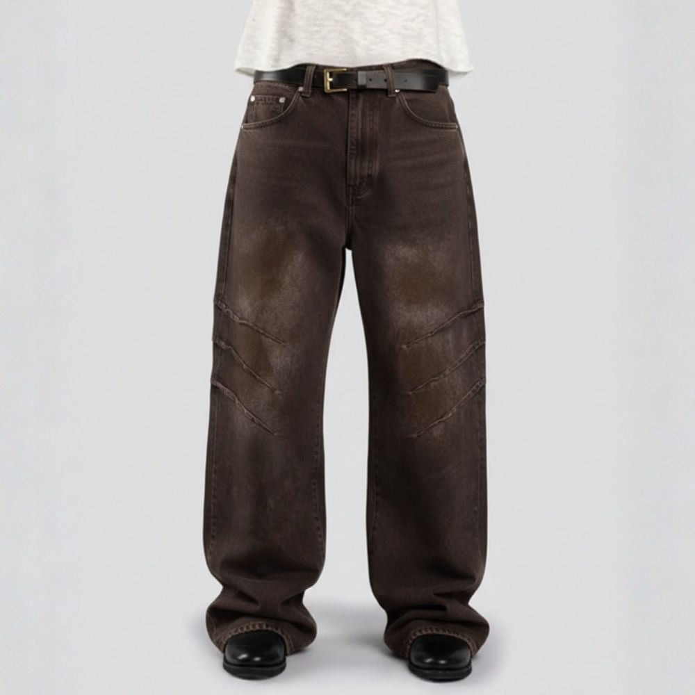 Brown jeans worn by a person on a light gray background