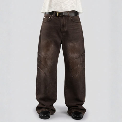 Brown jeans worn by a person on a light gray background