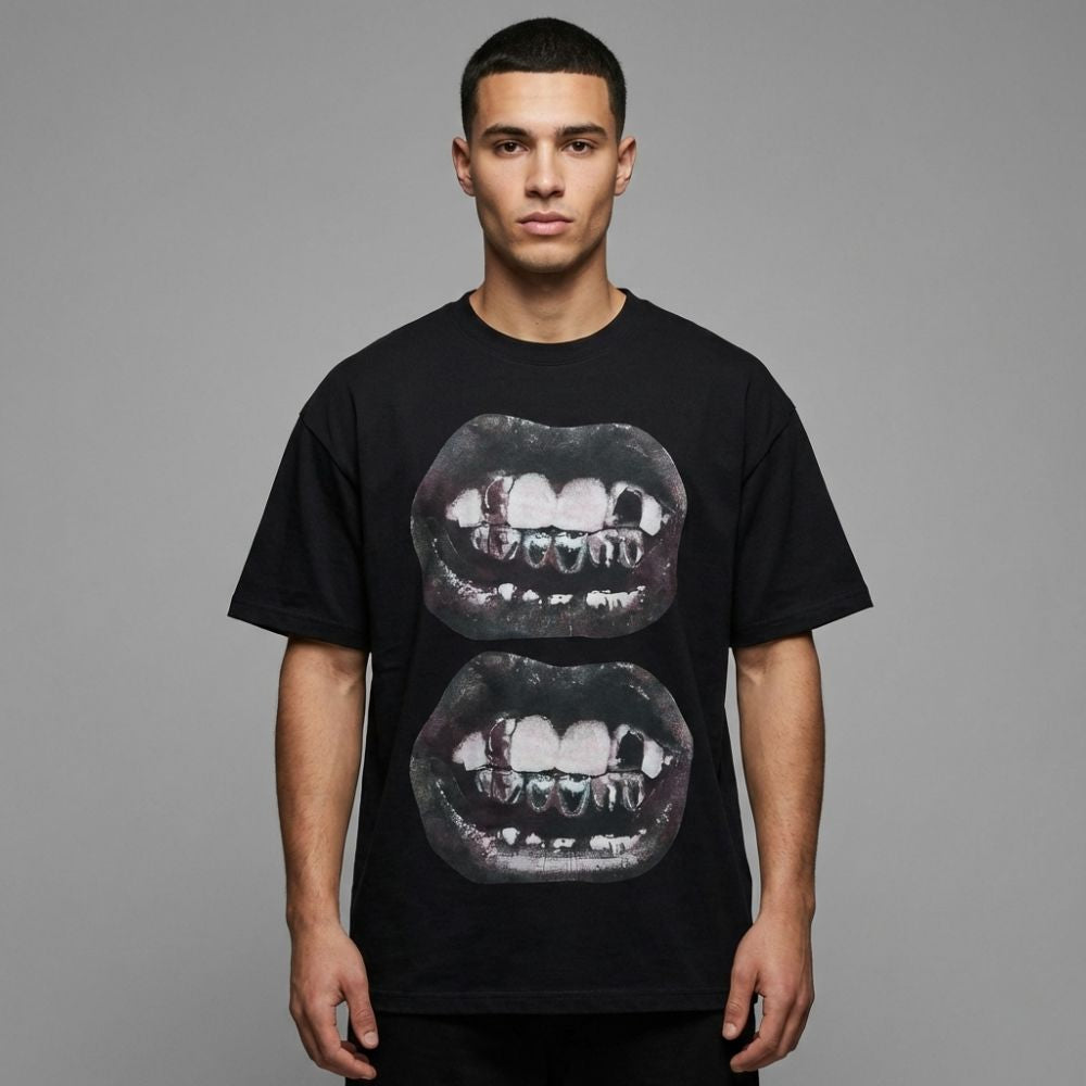 Person wearing a black t-shirt with graphic design on a gray background