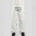 White cargo pants with black text on a gray background