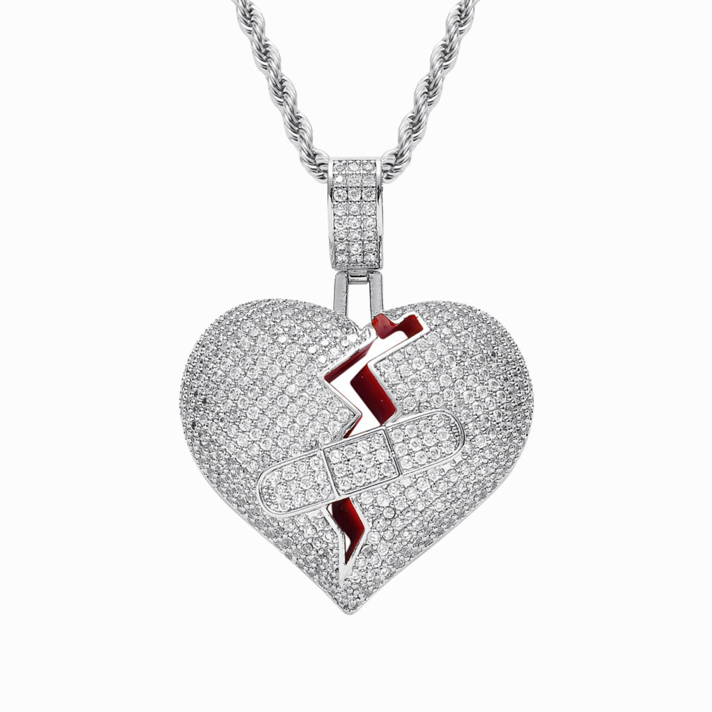Heart-shaped pendant with a lightning bolt design on a white background