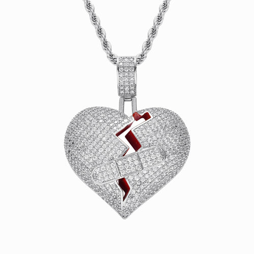 Heart-shaped pendant with a lightning bolt design on a white background