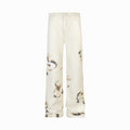 White pants with animal print on a white background
