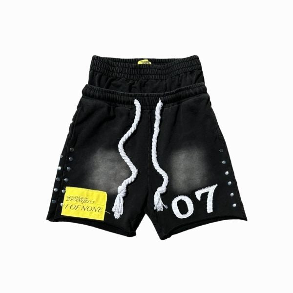 Black shorts with white drawstring and '07' branding on a white background
